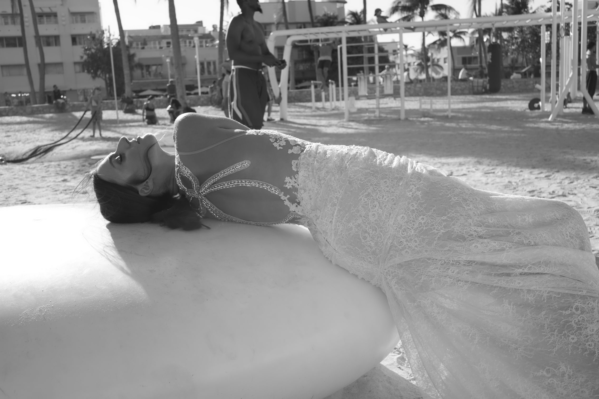 Netta BenShabu Isadora Wedding Dress - Fit & flare plunging V neck gown with floral appliques over lace, an illusion bodice and open back.