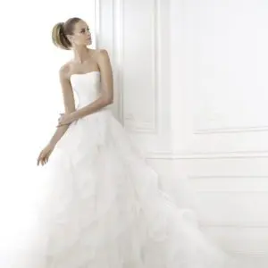 Pronovias Belia Wedding Dress Sample Sale - Stunning draped bodice dress with bateau neckline, frilly tulle skirt edged and a delicate nylon ribbon.