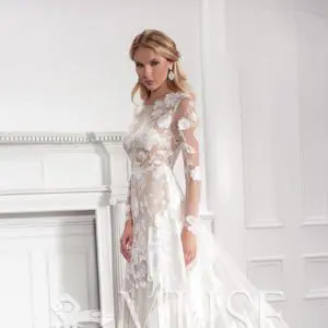 Modern Trousseau Brielle Wedding Dress Sample Sale - A - Line style dress with Scattered rose embroidered tulle over a fitted body and illusion long sleeves.