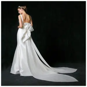 Sareh Nouri Naomi Wedding Dress - Soft trumpet gown made of Mikado with boat necklace, U-shaped back, cathedral bow detail and train.