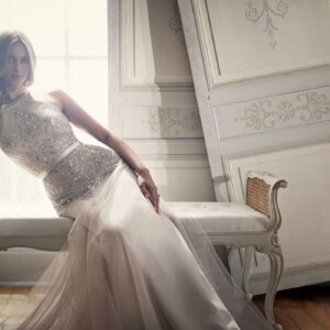 Suzanne Neville Deco Wedding Dress Sample Sale - Fit & flare dress with vintage pearl satin, High neckline, belt detail and delicate sequined tulle detail.