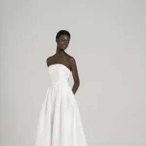 Peter Langner Gisele Wedding Dress - Strapless style silk dress with detachable foldoveron on neckline, belt detail with bow and pleats on skirt.
