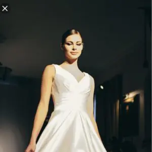 Suzanne Neville Novello Wedding Dress - Ball gown style dress with deep V-Neckline, low back, shoulder straps and waist band.