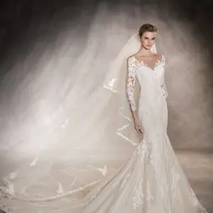 Pronovias Tibet Wedding Dress Sample Sale - Mermaid dress with allover lace, 3/4 sleeves gorgeous floral lace, Modified sweetheart neckline, and illusion v neck.