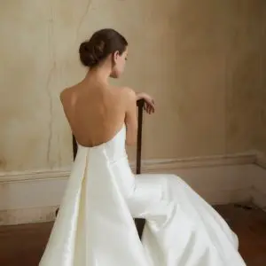 Allison Webb Beckwith Wedding Dress - Blended dupioni fit and flare gown, with a crescent neckline and a detachable watteau train.