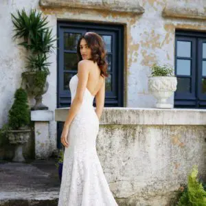 Allison Webb Laurel Wedding Dress - Fit and flare beaded Alencon lace gown, with a strapless curved neckline and buttons to the end of the train.