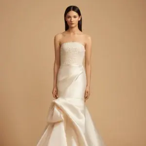 Allison Webb Penelope Wedding Dress - Ivory mikado asymmetrically draped fit to flare gown, with pearl crystal encrusted bodice with crescent neckline.