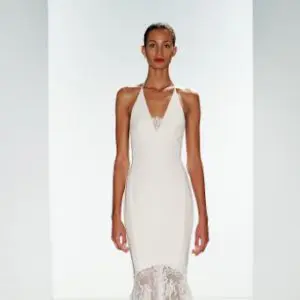 Slender skirt that flares into lace at the front to a sweeping mermaid finish.