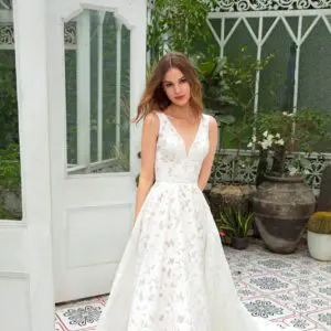 Dany Tabet Bella Wedding Dress - A Line style dress in all over lace with a natural waist, v-neckline, v back, fitted bodice, and train.