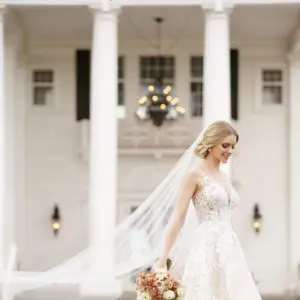 Martina Liana 1164 Wedding Dress Sample Sale - Ball gown with florals throughout, deep v neckline, thin straps, open back and a delicate shimmer effect.