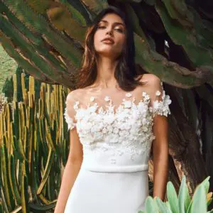Pronovias Masurian Wedding Dress Sample Sale - Classic A-line silhouette with an illusion bateau neckline, cap sleeves, belt detail and elegant train.