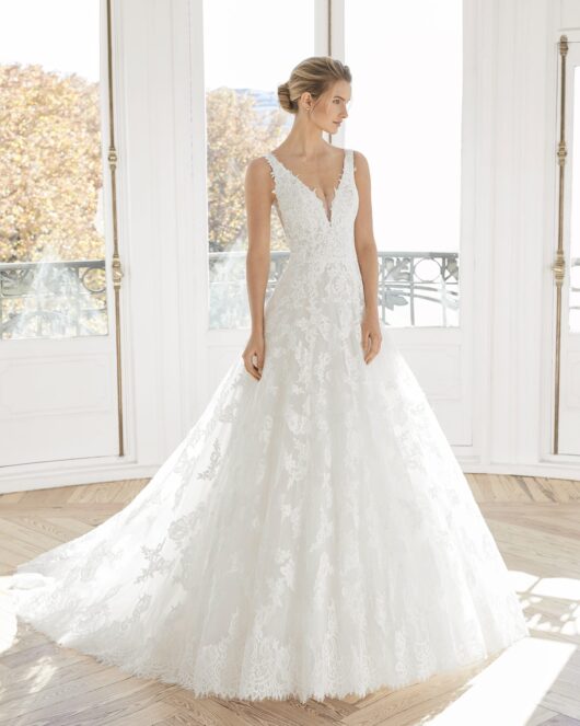 Rosa Clara Aire Espiral Wedding Dress - Elegant lace A-line with deep scalloped V-neckline, scoop back, shoulder straps and stunning cutout side.