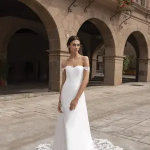 Pronovias Syrinx Wedding Dress Sample Sale - Sheath style with strapless sweetheart neckline, clean crepe fabric, off-the-shoulder straps, open back and train.