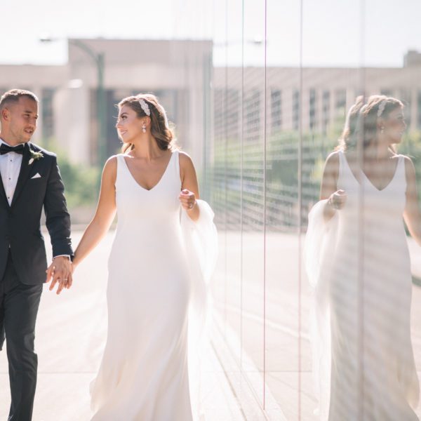 Caralyn & Miranda Wedding Atelier Real Bride - Martina Liana 685 Wedding Dress Sample Sale – Simple Crepe sheath wedding dress with deep v- neckline, straps and open low back with Crepe-covered buttons accent train.