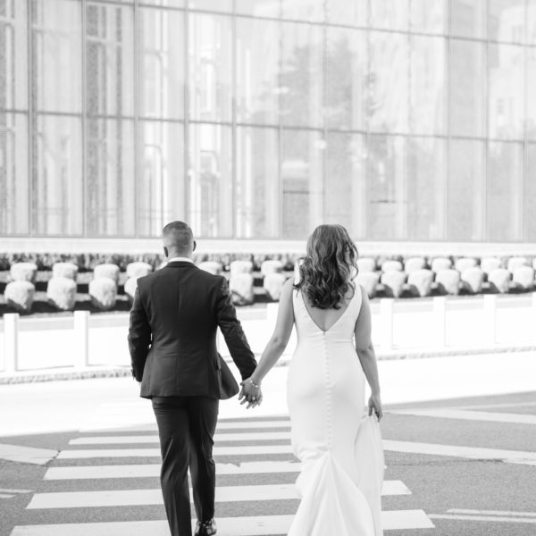 Caralyn & Miranda Wedding Atelier Real Bride - Martina Liana 685 Wedding Dress Sample Sale – Simple Crepe sheath wedding dress with deep v- neckline, straps and open low back with Crepe-covered buttons accent train.