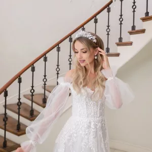 Estee Couture Kiki Wedding Dress - A Line style with a modified sweetheart neckline, Off the shoulder straps, detachable long sleeves and Train.