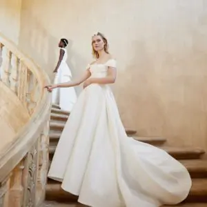 Peter Langner Novara Wedding Dress - Ballgown dress in jacquard with an off the shoulder neckline, fitted bodice, draped bust detail and train.