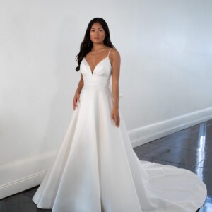 Martina Liana 1560 Wedding Dress - A Line with spaghetti straps, v-neckline, low squared back, detachable bow, covered buttons down the back and long train. 