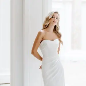 Suzanne neville Rosewood Wedding Dress - Fit to flare style dress with a fitted bodice, sweetheart neckline and draped detail with train. 