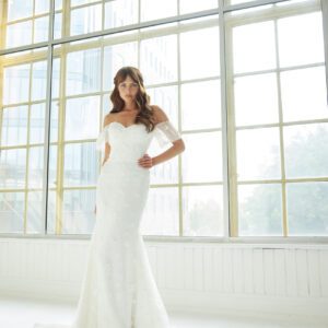 Suzanne Neville Tierra Wedding Dress - Fit and flare dress with sweetheart neckline, detachable off the shoulder sleeves, 3D Appliqués, and small train.