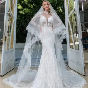 Estee couture Daphne Wedding Dress - Fit and flare french lace gown with soft tulle underlay, long sleeves, sheered neck details and buttons back closure.