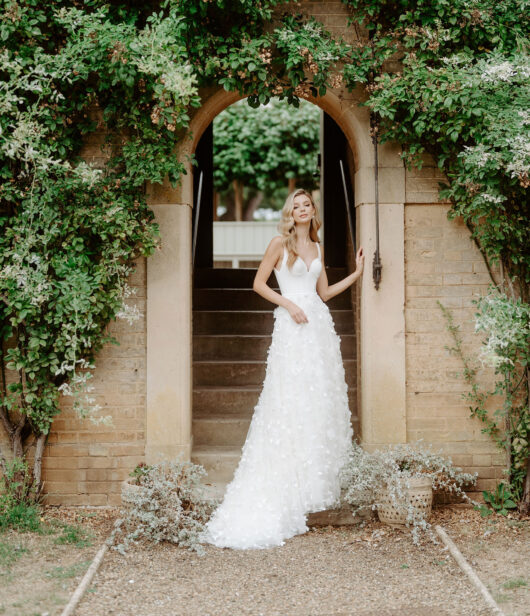 Suzanne Neville Montage Wedding Dress - Sophisticated, timeless wedding  dress with iconic tailoring, V-neckline and straps. - Wedding Atelier NYC