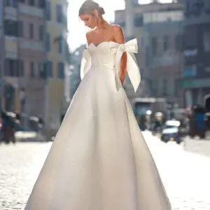 Pronovias Deva Wedding Dress Sample Sale – Floral Jacquard Ballgown with strapless sweetheart neckline, corset fitted bodice and, belt. Bow on sleeves.
