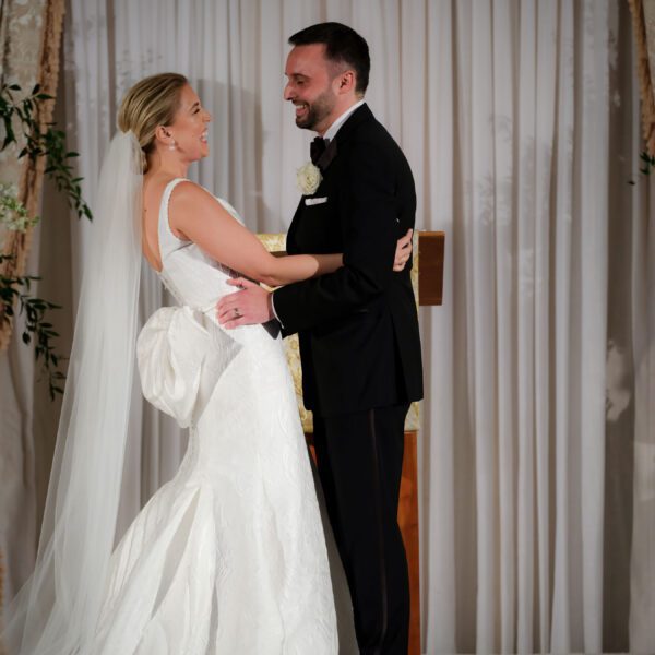Brittany & David Wedding Atelier Real Bride - Allison Webb Claremont Wedding Dress Sample Sale – Timeless Classic Fit and Flare Bridal Gown with Scoop Neckline, Low Back, and Bow Detail.
