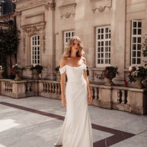 Suzanne Neville Degas Wedding Dress - Degas has a scoop neck corseted bodice with off the shoulder straps and a ruched fitted skirt in satin crepe.