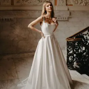 Suzanne Neville Bussotti Wedding Dress - A-Line with interior boning, low square neckline, shoulder straps, a low cut open back and a slim waist belt.