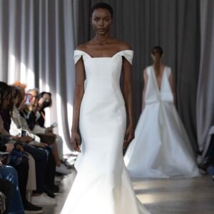 Peter Langner Lidia Wedding Dress - Fit & Flare dress with architectural off the shoulder silhouette in silk mikado with drapings on the back.