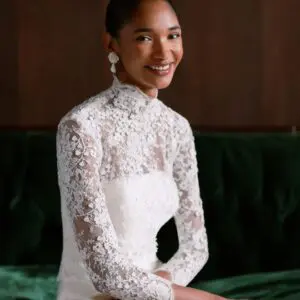 Sareh Nouri Maryanne Wedding Dress - Italian Magnolia straight edge neckline slim flare gown with seamwork detail. Shown with detachable 3D embroidered ¾ length bolero with chantilly trim.