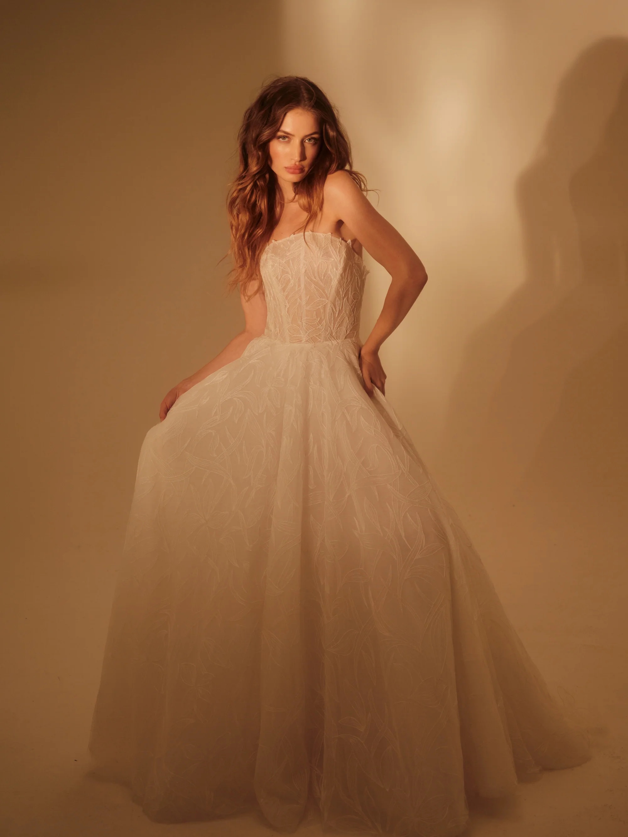 Enaura Colette Wedding Dress - A Line style dress featuring a strapless scoop neckline, floral lace petals, printed lace, for a romantic and timeless look.