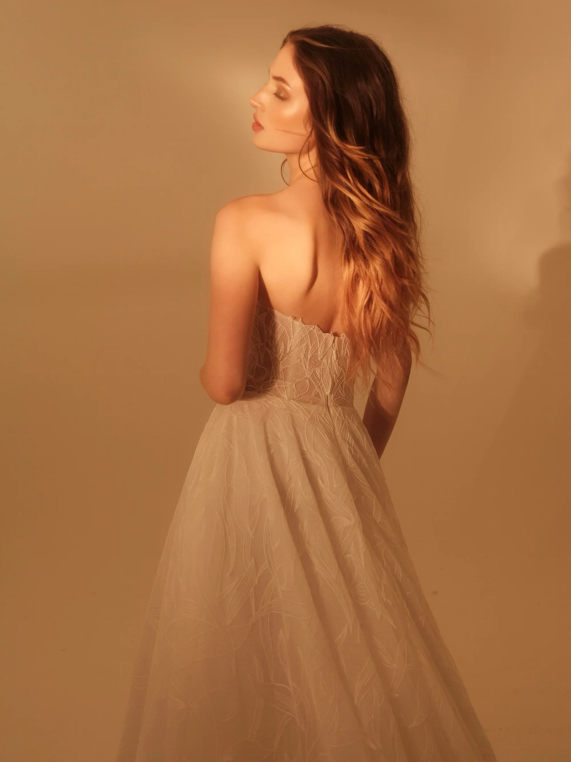Enaura Colette Wedding Dress - A Line style dress featuring a strapless scoop neckline, floral lace petals, printed lace, for a romantic and timeless look.