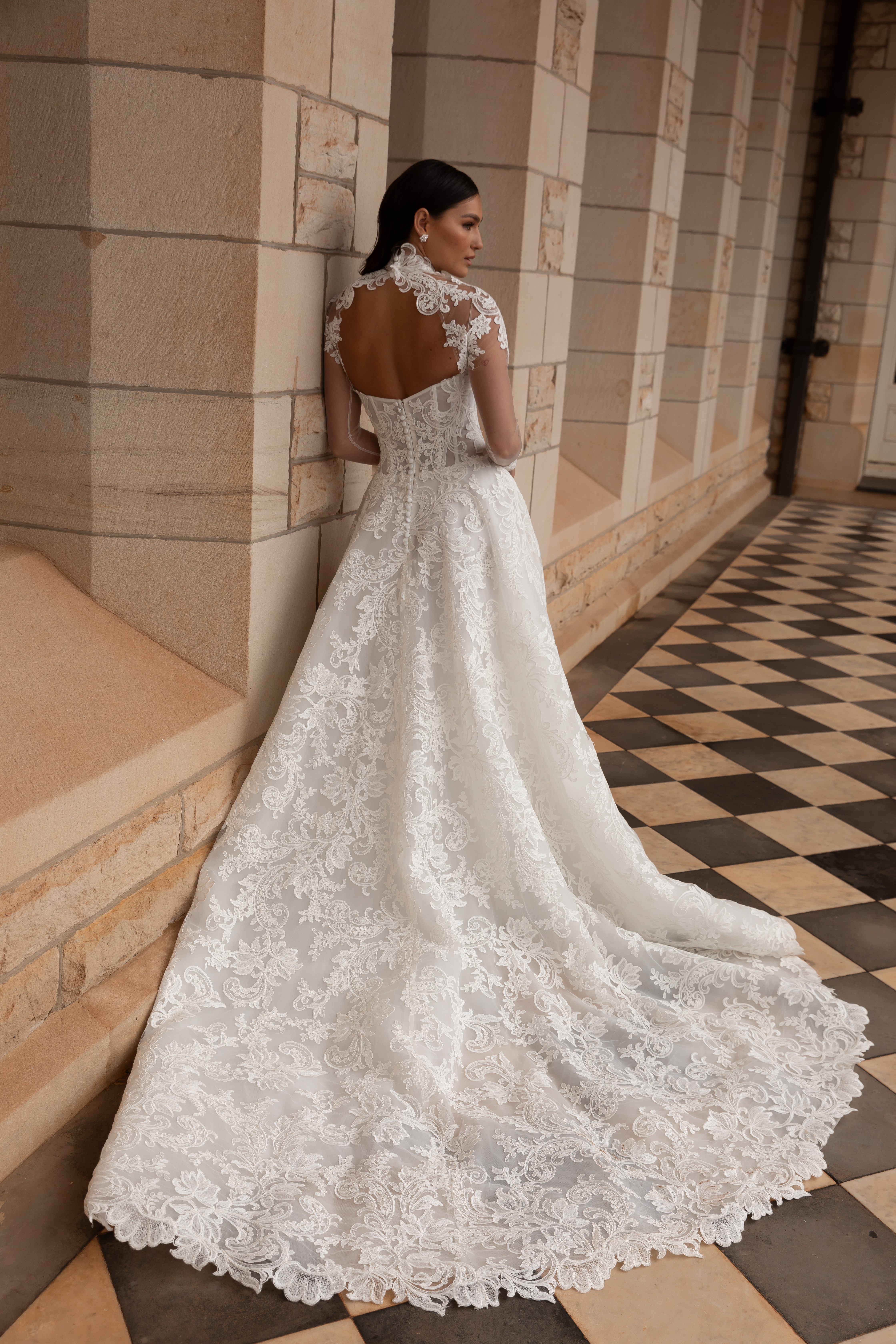 La Premiere Amber Wedding Dress - A-Line style dress featuring a chic cat-eye neckline, drop-waist design, full-cut corded lace and exposed boning.