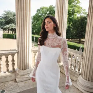 Suzanne Neville Aurora Wedding Dress - Romantic Modern Couture Fit and Flare Bridal Gown with Natural Waist, High Neck, Long Sleeves, Corset and Train Details and Lace Fabric