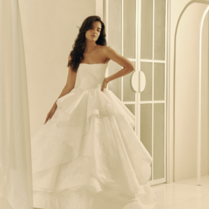 Stephanie Cachapuz Grace Wedding Dress - Glamorous Princess Bridal Gown with Natural Waist, Straight Strapless Neckline, Ruffle Skirt Detail and Lace Fabric.