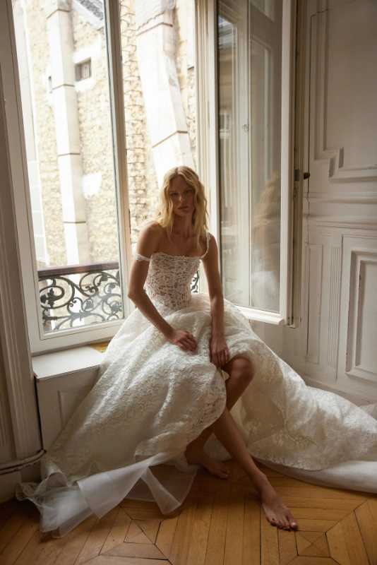 Netta BenShabu Hazel Wedding Dress - Modern Romantic Bridal Gown with Drop Basque Waist, Straight Strapless Neckline, Texture, Corset, Low Back Details in Lace.