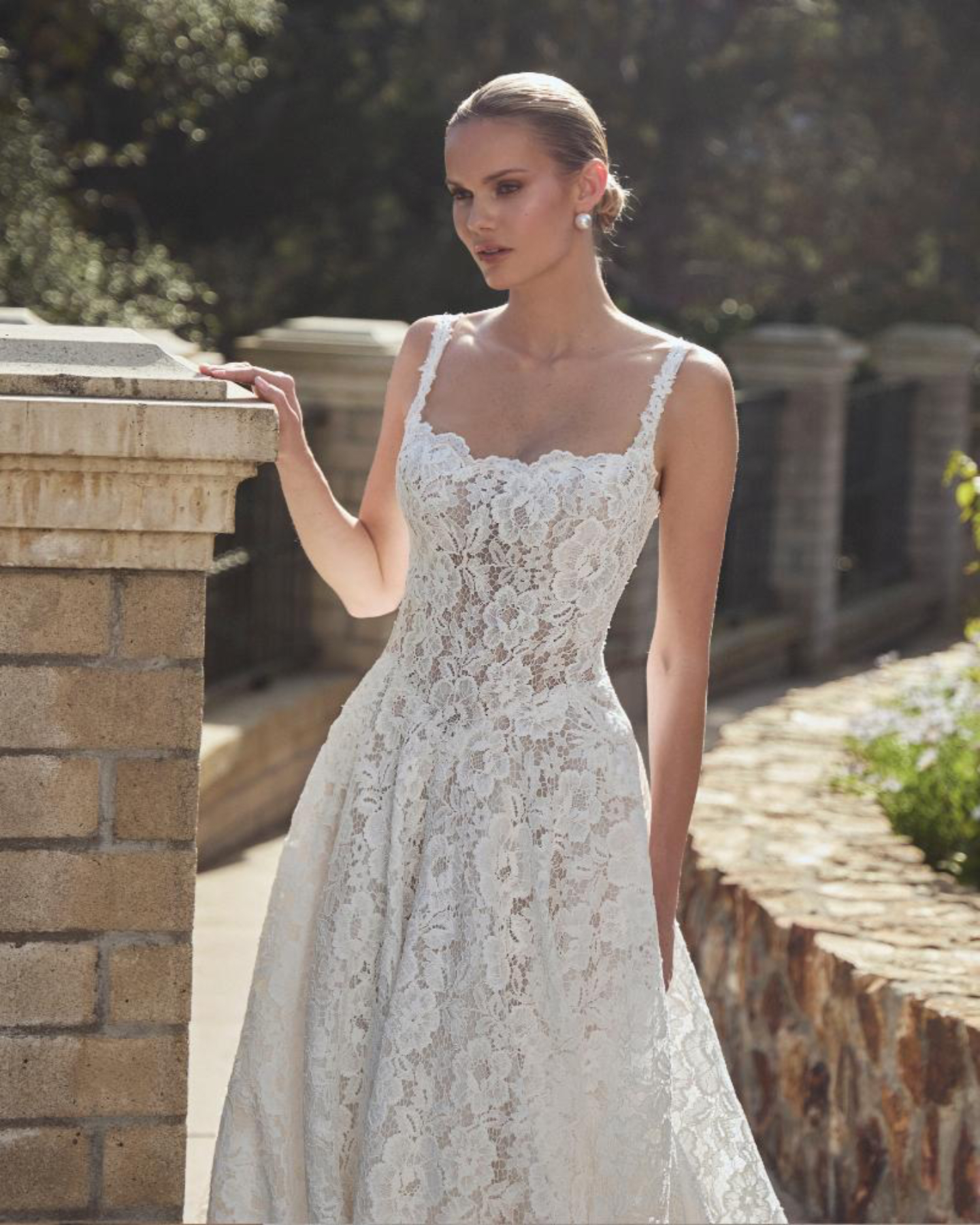 Calla Blanche Dara Wedding Dress - Romantic Sexy Corsetry A-Line Bridal Gown with Drop Basque Waist, Straight Neck, Straps, Low Back, Floral Details and Lace Fabric.